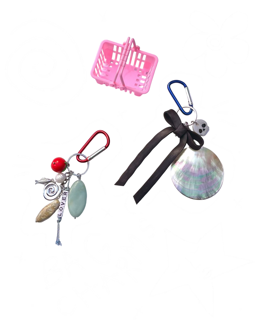 Two keychains with charms on a light purple background