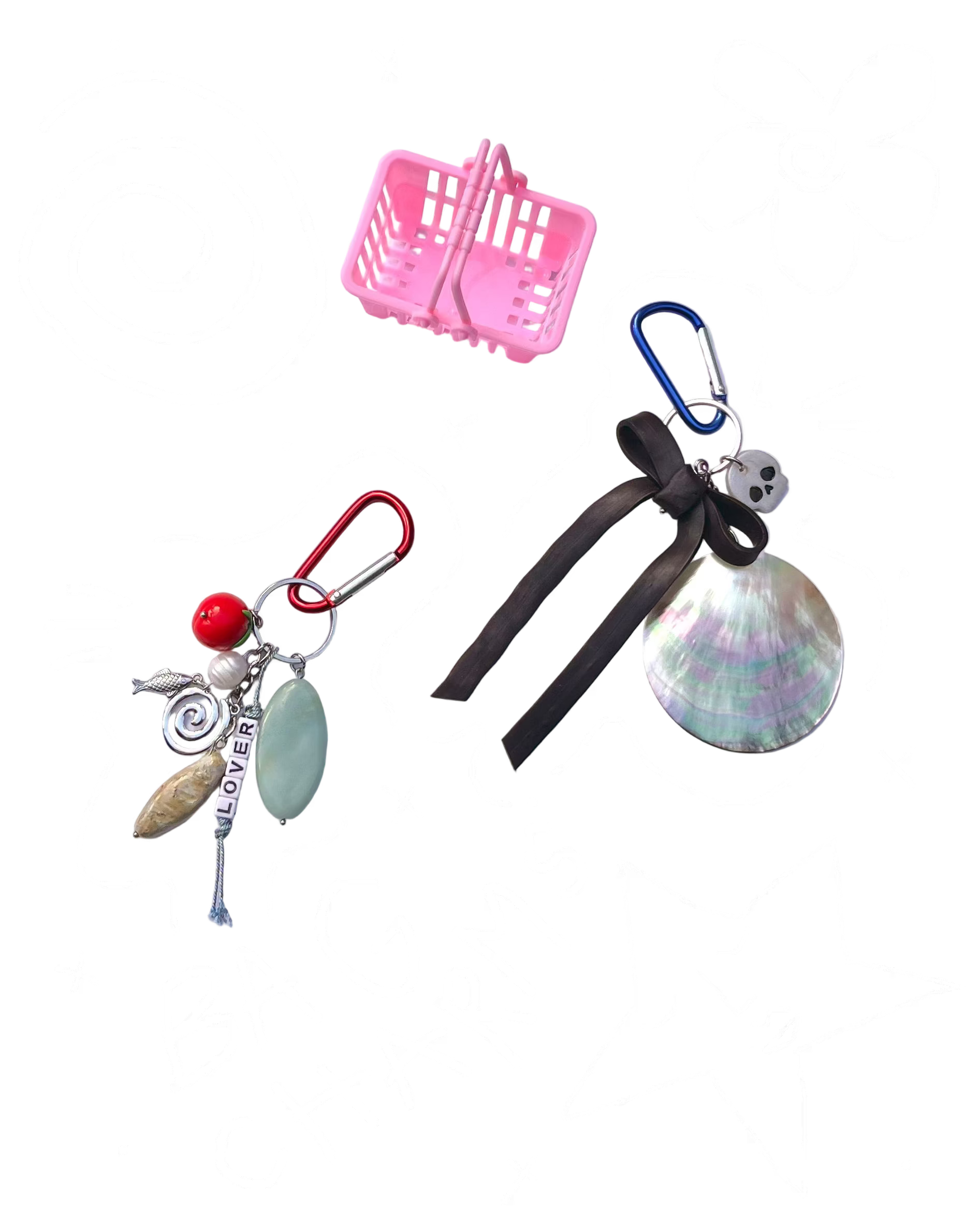 Two keychains with charms on a light purple background